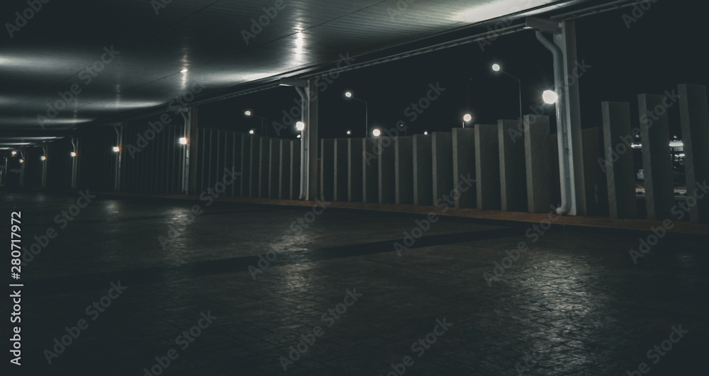 Abstract modern architecture, urban street background in night, concrete exterior with vertical column. Empty space for your design or product display. Dark tone image