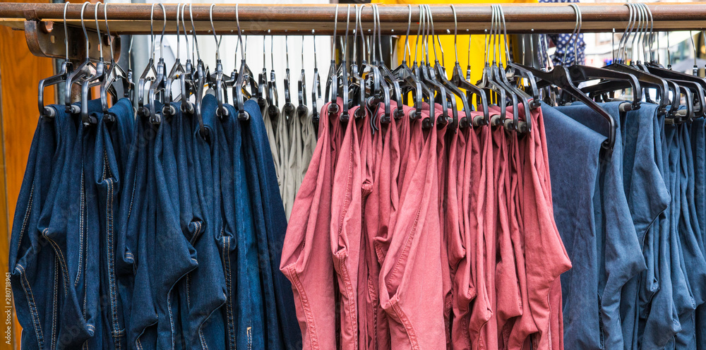 blue, pink, red, pants hanging on rack