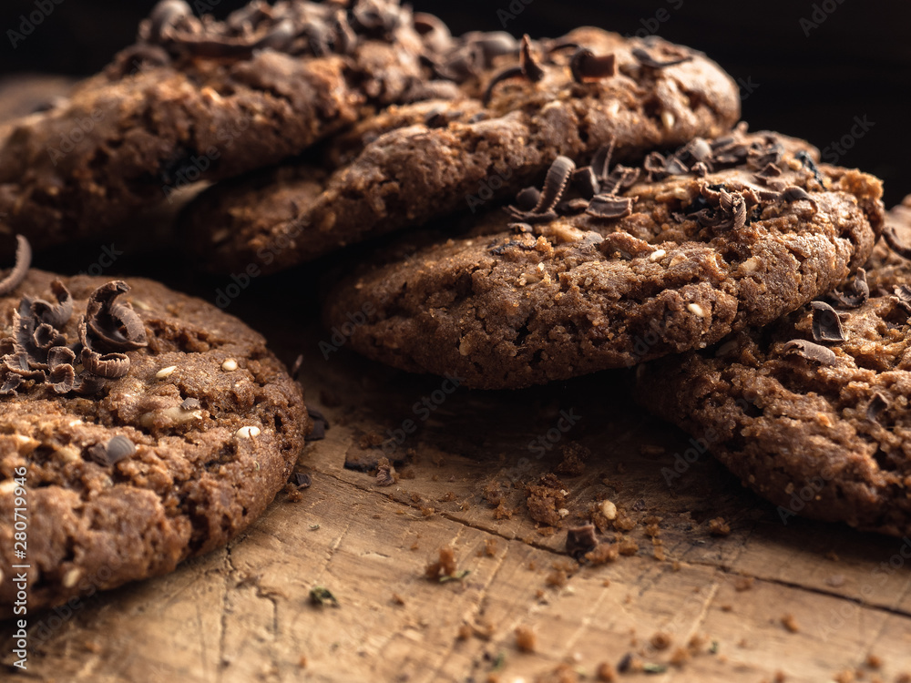 Fototapeta premium oatmeal cookies with chocolate sprinkle on a wooden board