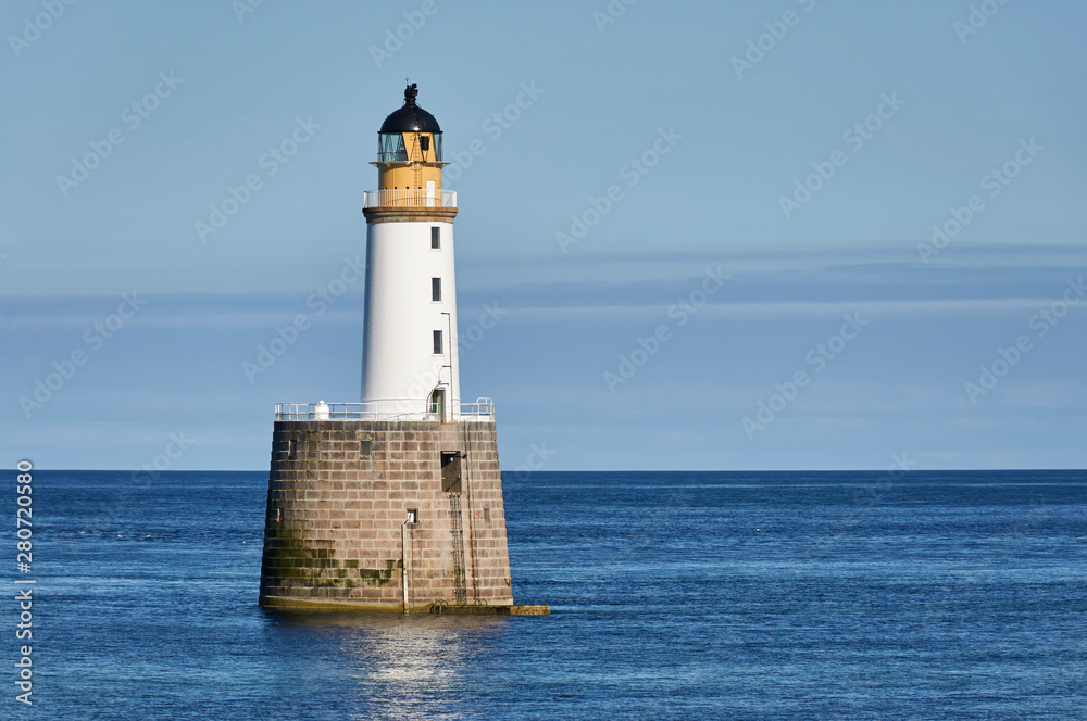 Rattray Head Lighthouse just off Rattray Point in Aberdeenshire, Scotland, on one fine Summers Afternoon in calm conditions.