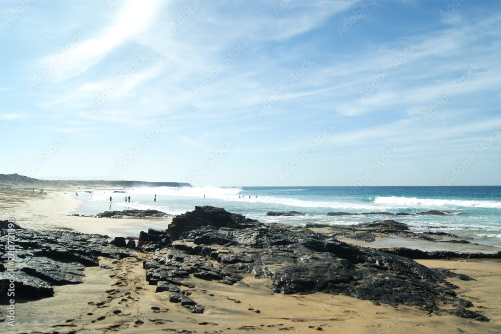 Spain, the island of Fuerteventura. A view of Piedra beach at the village of El Cotillo. The surf from the Atlantic rolls in. Spain, the island of Fuerteventura. A view of Piedra beach at the village of El Cotillo. The surf from the Atlantic rolls in.