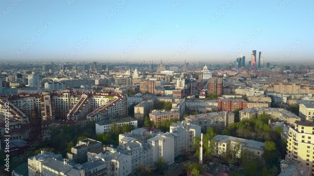 Aerial view of a city area with architecture of different types, including a couple of skyscrapers on the horizon Aerial view of a city area with architecture of different types, including a couple of skyscrapers on the horizon
