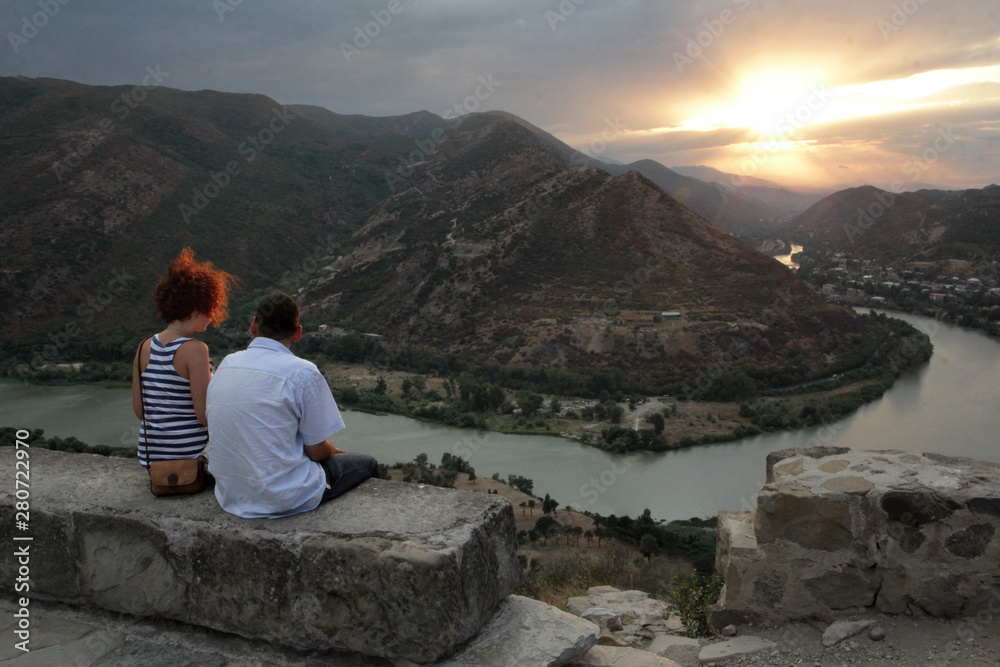 The couple admires the merging of the Aragvi and Kura rivers