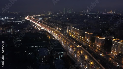 Wallpaper Mural Flying over a night city with a wide illuminated highway Torontodigital.ca