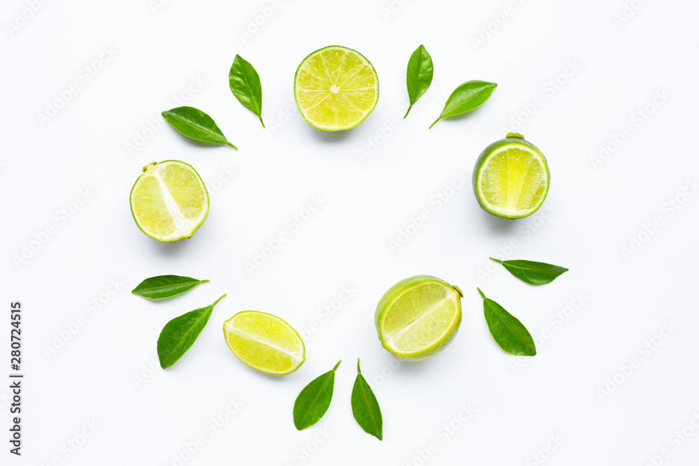 Limes with leaves isolated on white background. Limes with leaves isolated on white background.