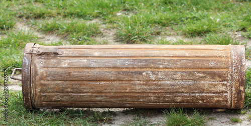 An old metal cassette the form of a roller in the garden.Used in the Second World War by the German army.