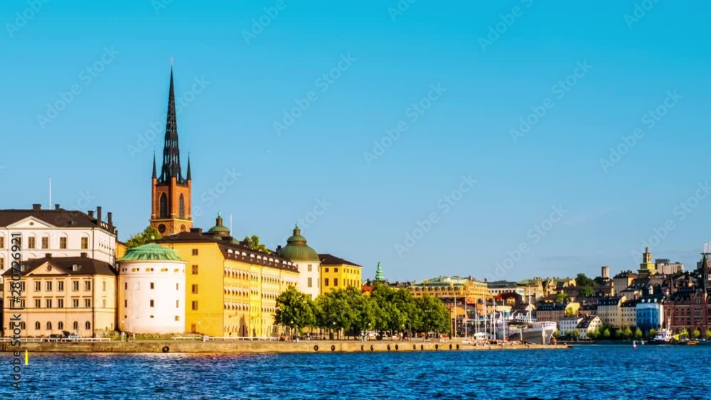 Stockholm, Sweden. Time-lapse of Gamla Stan in Stockholm, Sweden with landmarks like Riddarholm Church during the sunny summer day. View of old buildings, panning video Stockholm, Sweden. Time-lapse of Gamla Stan in Stockholm, Sweden with landmarks like Riddarholm Church during the sunny summer day. View of old buildings, panning video
