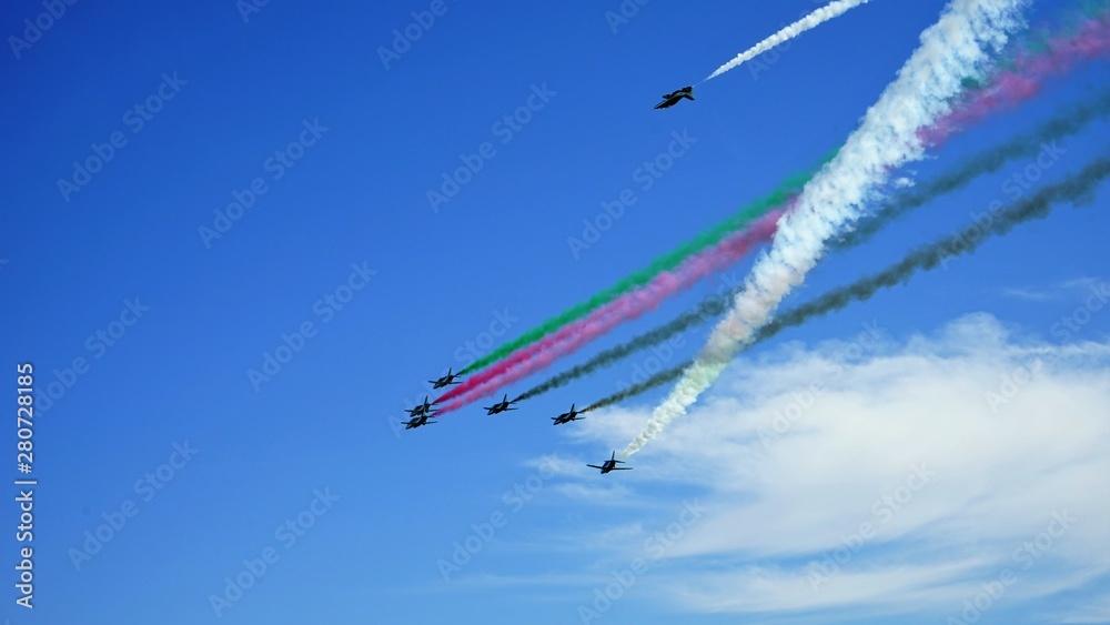 airplanes in the sky and multi colored stripes 