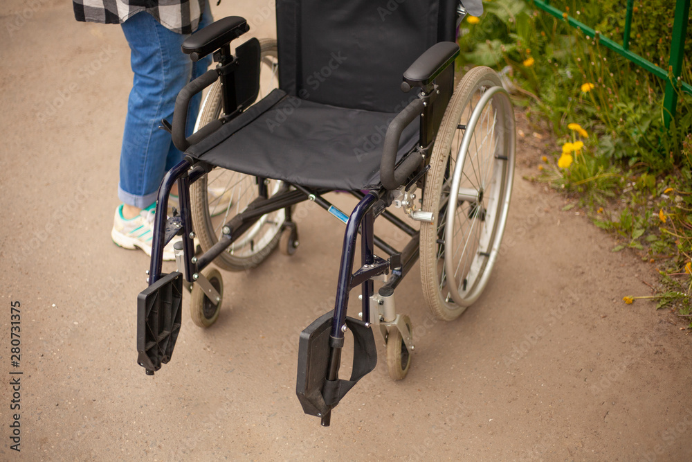 Obraz premium Wheelchair. Armchair for transporting people with disabilities. Medical equipment to make life easier for people with motor disease