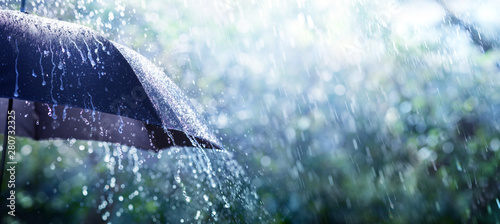 Fotografia Rain On Umbrella - Weather Concept