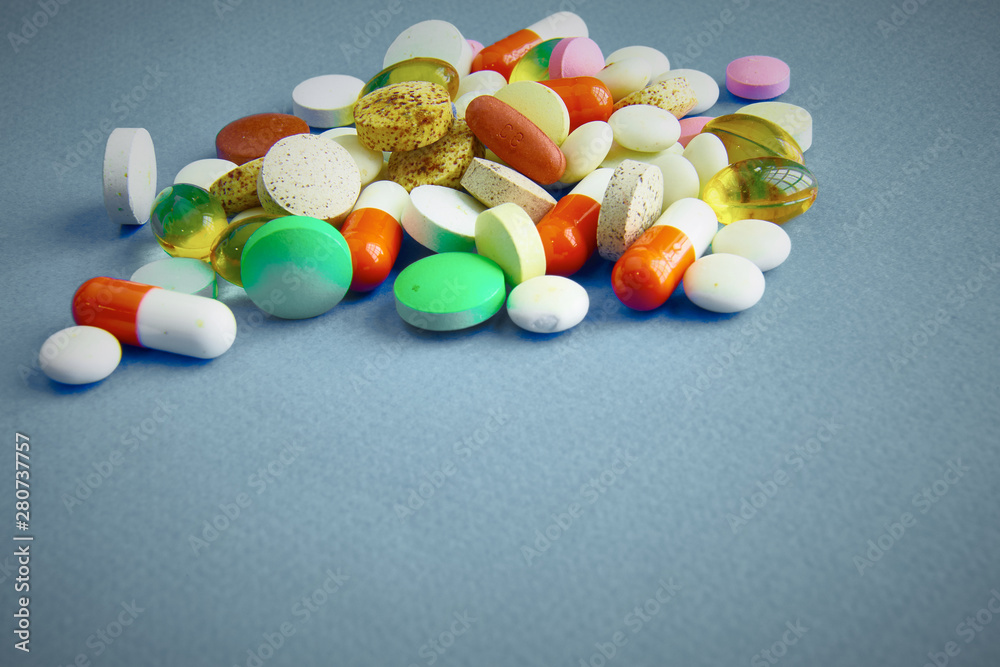 Assortment of pills, tablets and capsules on table Assortment of pills, tablets and capsules on table