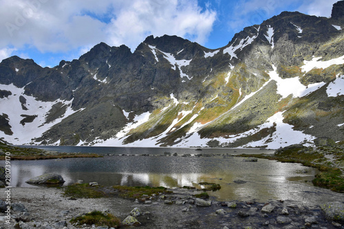 The mountain lake Vel'ke Hincovo pleso with the Mengusovske mountains in the High Tatras.