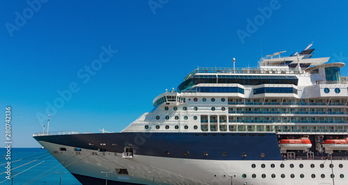 A large luxury cruise liner moored in the port of the Adriatic Sea  is waiting for passengers. There are four orange lifeboats abroad of a cruise ship in Koper  Slovenia.