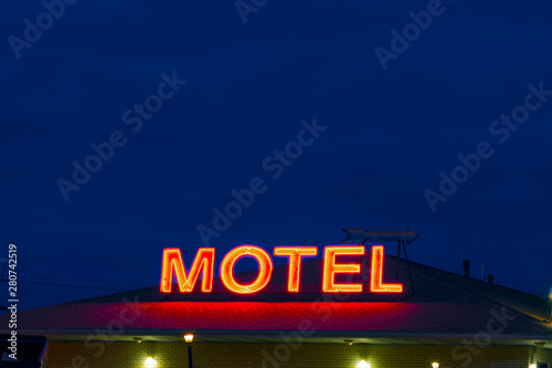 Neon sign reading “MOTEL”