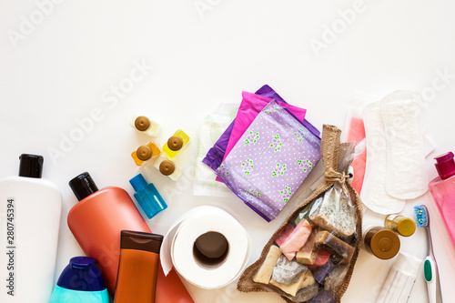 Toothbrush, wooden comb, white shampoo bottle and bath sponge on a white background. Flat lay. top view beauty items. Bathroom set