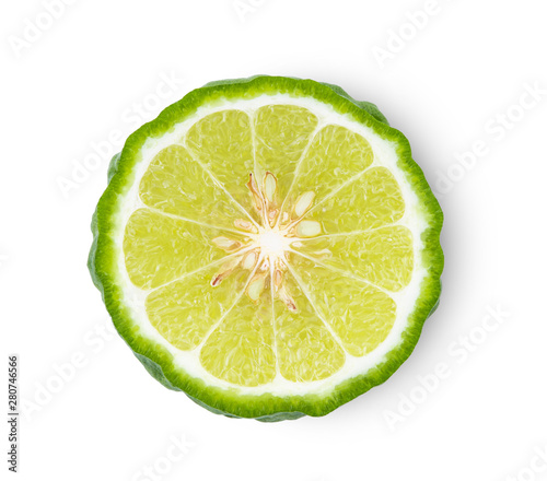 A half of bergamot or kaffir with seeds isolated on white background.