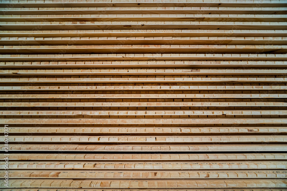 Stack of natural rough wooden boards. Wooden boards, lumber, industrial wood. Stack of natural rough wooden boards. Wooden boards, lumber, industrial wood.