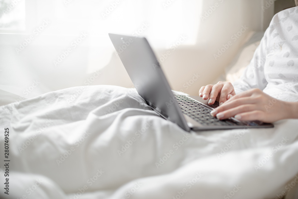 Work from home concept . Blonde Giirl typing and using laptop. Hygge Horizontal copyspace Work from home concept . Blonde Giirl typing and using laptop. Hygge Horizontal copyspace