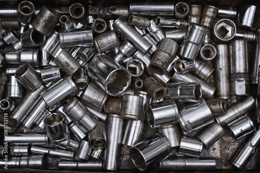 Wrench sockets in metal tray. Wrench sockets in metal tray.