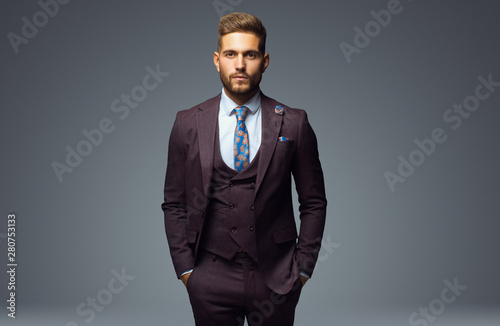 Принти на полотні Stylish young man in suit and tie