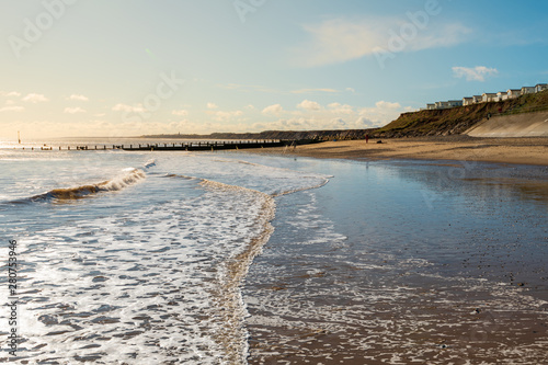 Hornsea Beach shot early on a sunny morning with the caravan park to the right and a low tide to the left. One of the cleaner UK beaches found in East Yorkshire photo