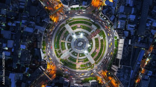 Aerial top view traffic road roundabout in city at night, Time lapse top road in bangkok.