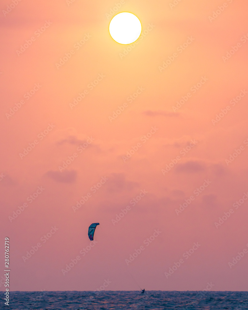 Sunset and kite surfing on the beach of Cartagena, Colombia