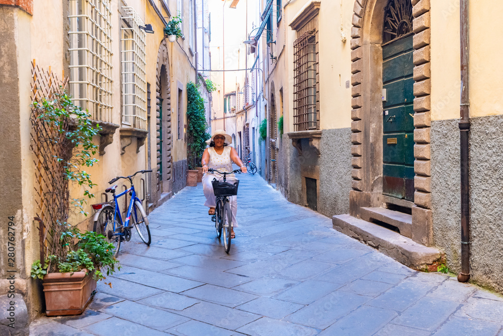 Woman Riding A Bike In Italy