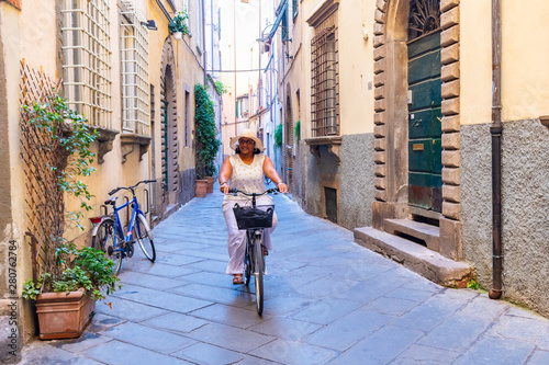 Woman Riding A Bike In Italy
