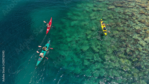 Canvas Print Aerial drone photo of colourful sport canoes operated by young athletes competin