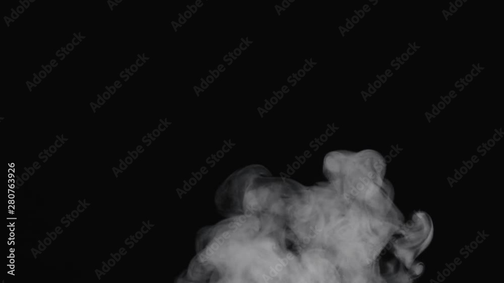 Slow motion of water vapor cloud comes from below over black background Slow motion of water vapor cloud comes from below over black background