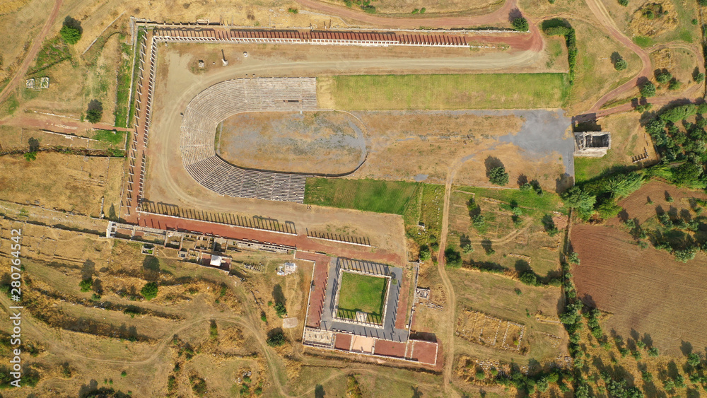 Obraz premium Aerial drone photo of unique and well preserved archaeological site and citadel of Ancient Messene featuring massive stadium and theatre, Messinia, Peloponnese, Greece