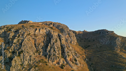 Aerial drone panoramic view of iconic uphill medieval castle of Acrocorinth an ancient citadel overlooking ancient Corinth, Peloponnese, Greece