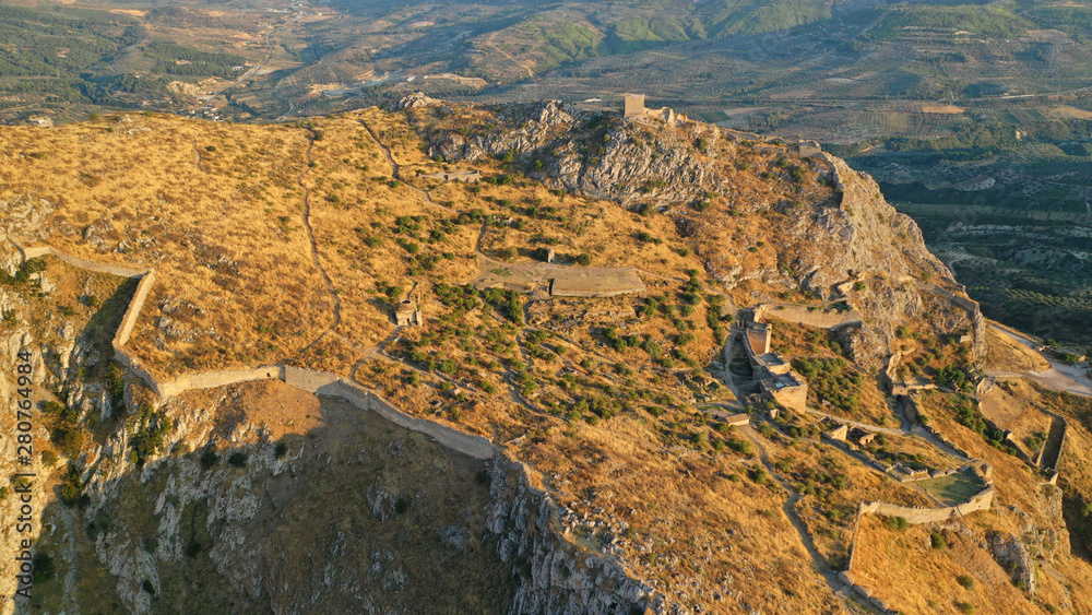 Aerial drone panoramic view of iconic uphill medieval castle of Acrocorinth an ancient citadel overlooking ancient Corinth, Peloponnese, Greece