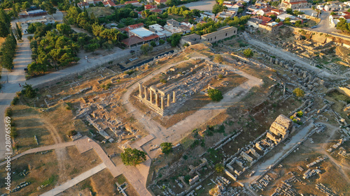 Aerial drone photo of iconic archaeological site of Ancient Corinth featuring temple of Apollo built in the slopes of Acrocorinth, Peloponnese, Greece © aerial-drone