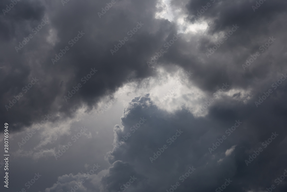 Cumulonimbus clouds in the blue sky. Harbingers of rain. Sky pattern.	