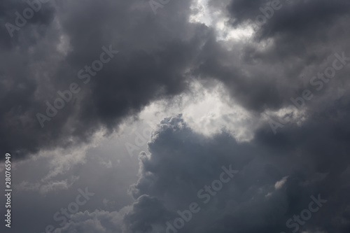 Cumulonimbus clouds in the blue sky. Harbingers of rain. Sky pattern. 