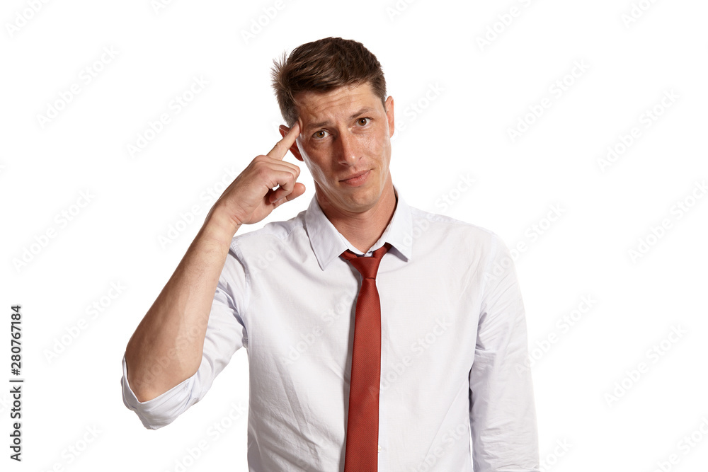 Portrait of a young brunet man posing in a studio isolated over a white background. Portrait of a young brunet man posing in a studio isolated over a white background.