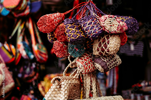Bunch of handmade purses made from natural Abaca plant. Animal free. Selective focus.
