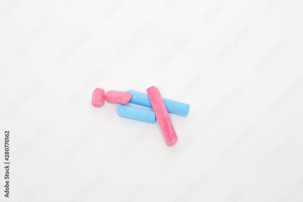 Pile of colorful chalk isolated white background, blue and pink Pile of colorful chalk isolated white background, blue and pink
