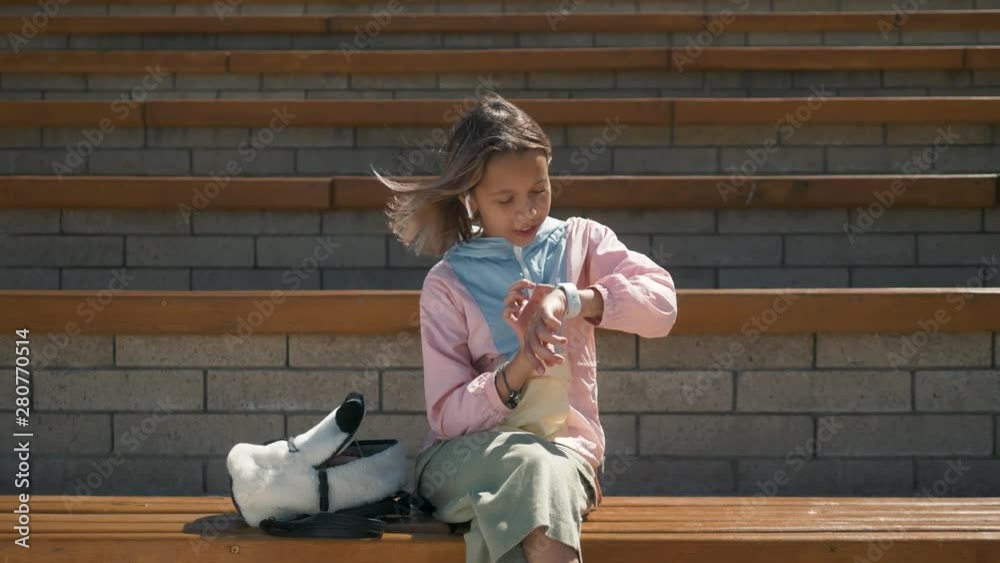 Kid Using Smartwatch or Smart Watch, school Kid with Smartwatch Child using smartwatch on her wrist Kid Using Smartwatch or Smart Watch, school Kid with Smartwatch Child using smartwatch on her wrist