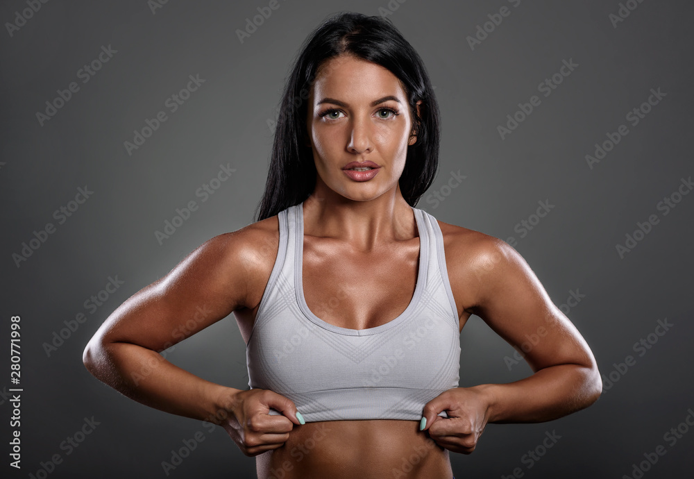 Studio portrait of beautiful young fitness instructor woman Studio portrait of beautiful young fitness instructor woman