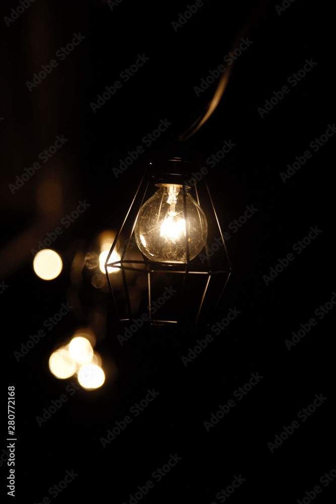 old lamp on a black background