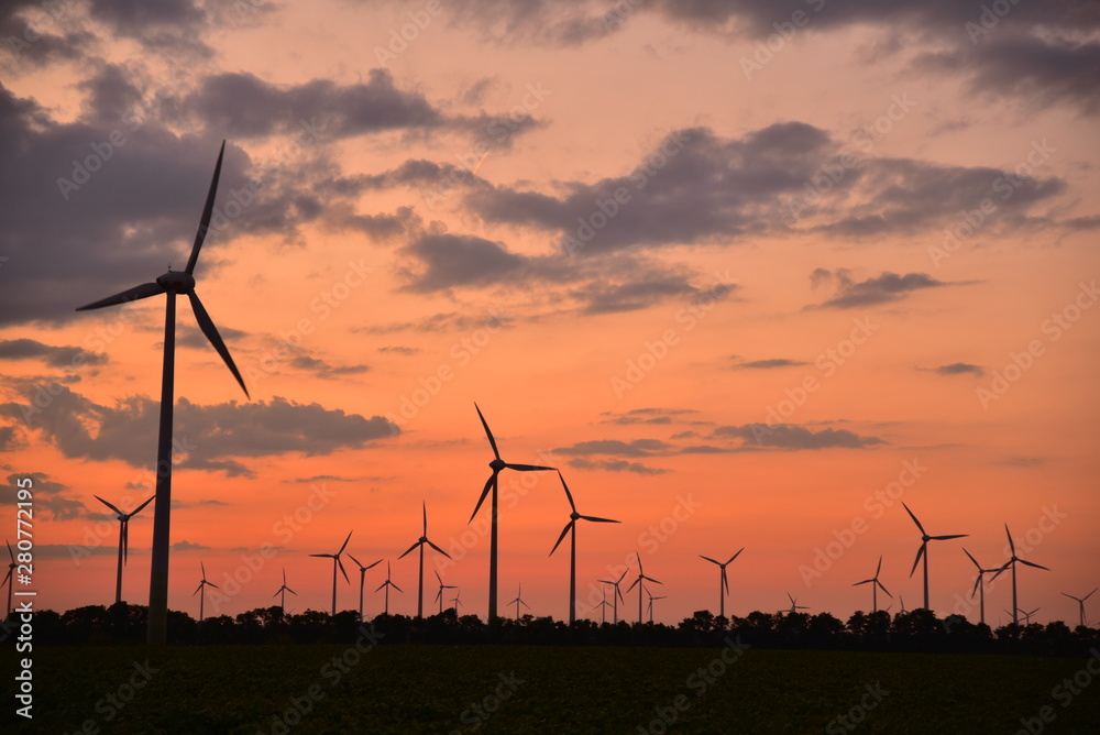 Wind turbines for green energy generation at dusk in Burgenland. Wind turbines for green energy generation at dusk in Burgenland.