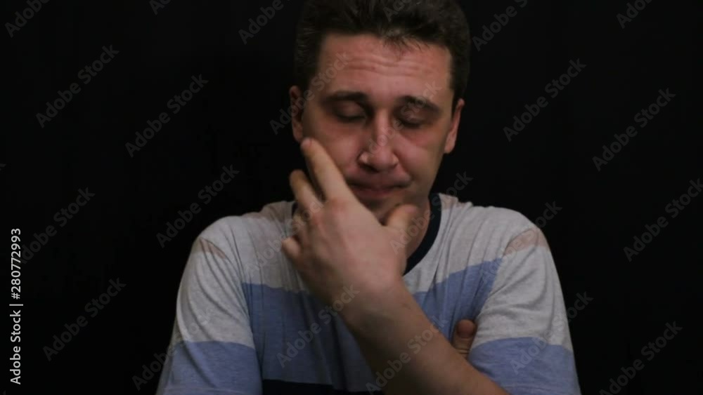 compassionate young handsome caucasian man shows his emotion close-up compassionate young handsome caucasian man shows his emotion close-up