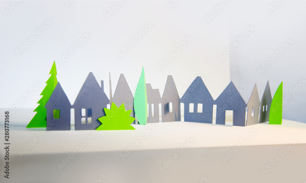 Little town houses in raw. City, property and house buying concept. Paper cut design background.