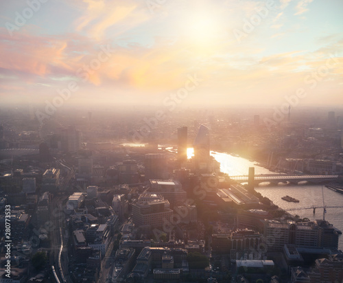 London, UK. City of London at sunset. Aerial view include London skyscrapers and river Thames 