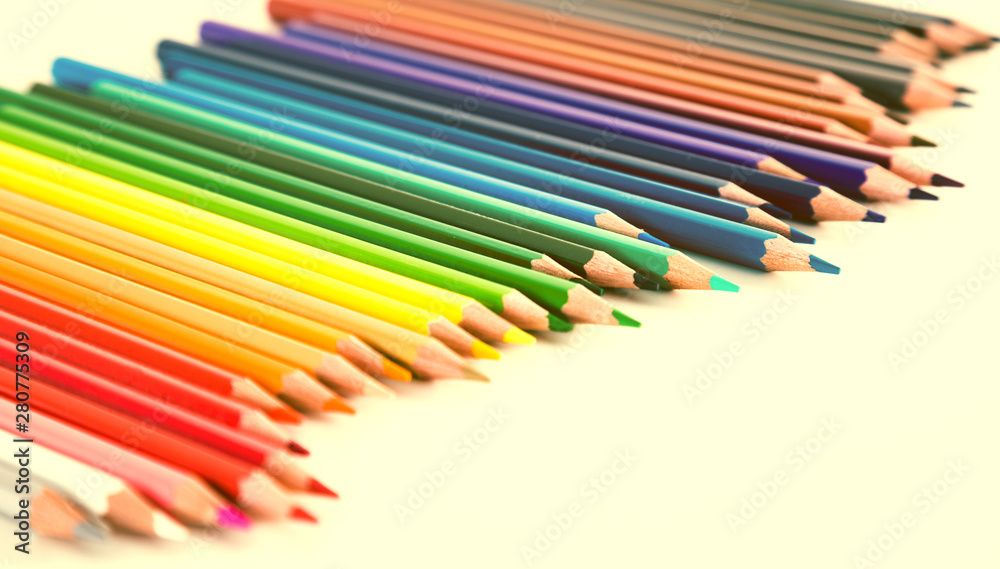 colored pencils lying in irregular row colored pencils lying in irregular row