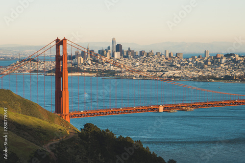 View of the beautiful famous Golden Gate Bridge in San Francisco, California in daylight from the hills