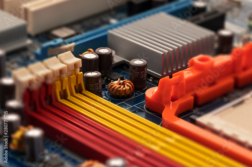 Fragment of the motherboard. Elements of computer equipment. Electronic component. Repair digital device. Close-up. Selective focus.